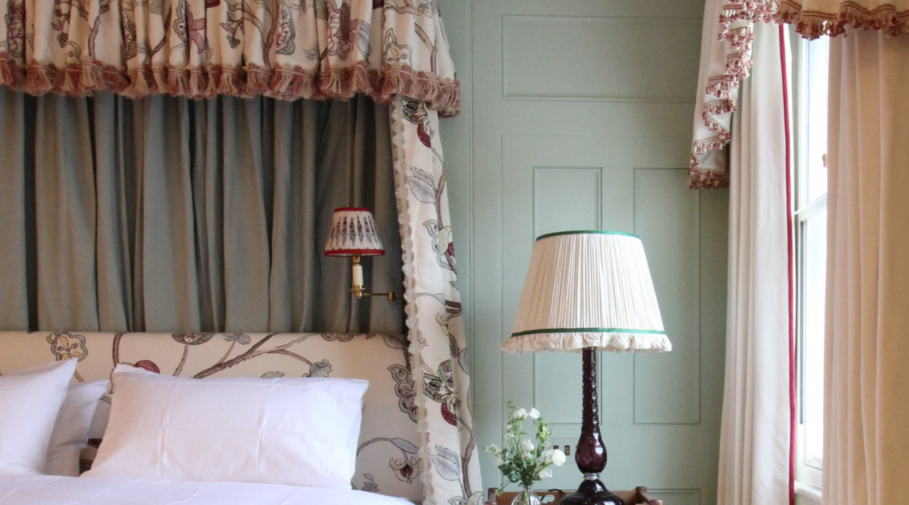 Close up view of a bright bedroom with a lovely textured headboard and bed